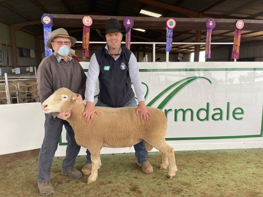 Kevin Bradford, Harden, with the top priced ram and Sam Mooney, manager, Armdale Poll Dorsets, Marrar.