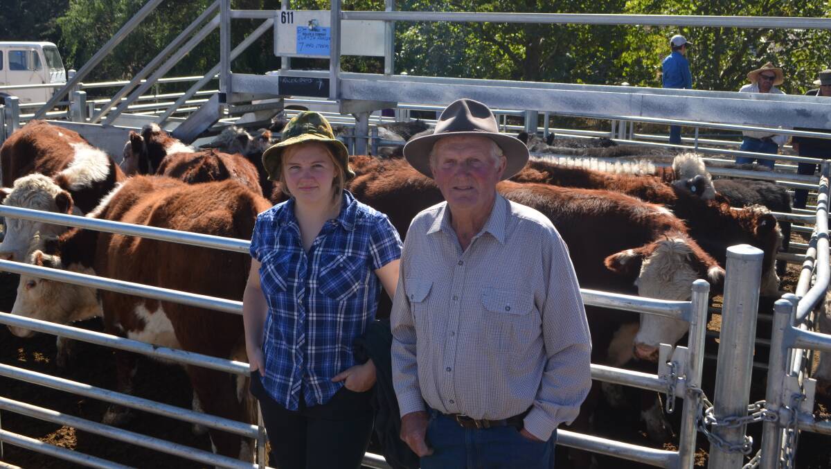Work experience student Christina Pook with Jeff Fraser, Adaminaby with their seven Hereford steers sold for $930