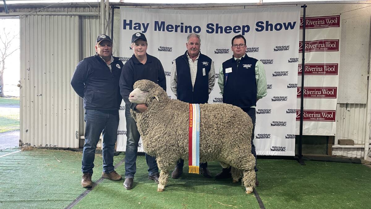 Paul and Darcy Meyer, Mulloorie, Brinkworth, SA, with their supreme exhibit and grand champion ram and judges Andrew Calvert and Spike Orr.