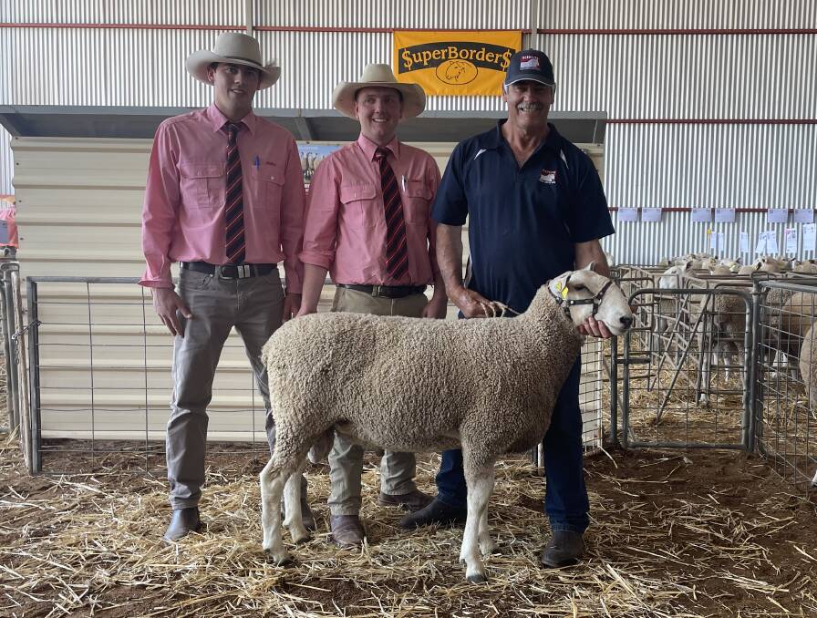 Auctioneers Harry Waters and Nick Gray, Elders, with Wes Kember, Gleneith Border Leicester stud, Ganmain, and the top priced ram bought by the Jackson family, Jackson Farming, Moyston, Victoria. 