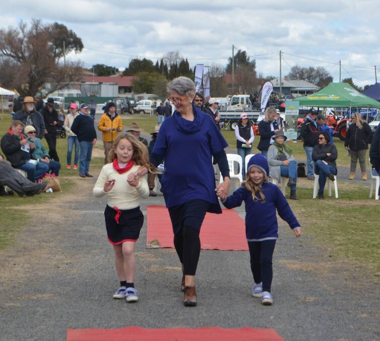 On the catwalk: Marg Roles with her granddaughters, Edith and Maeve during the fashion parade.