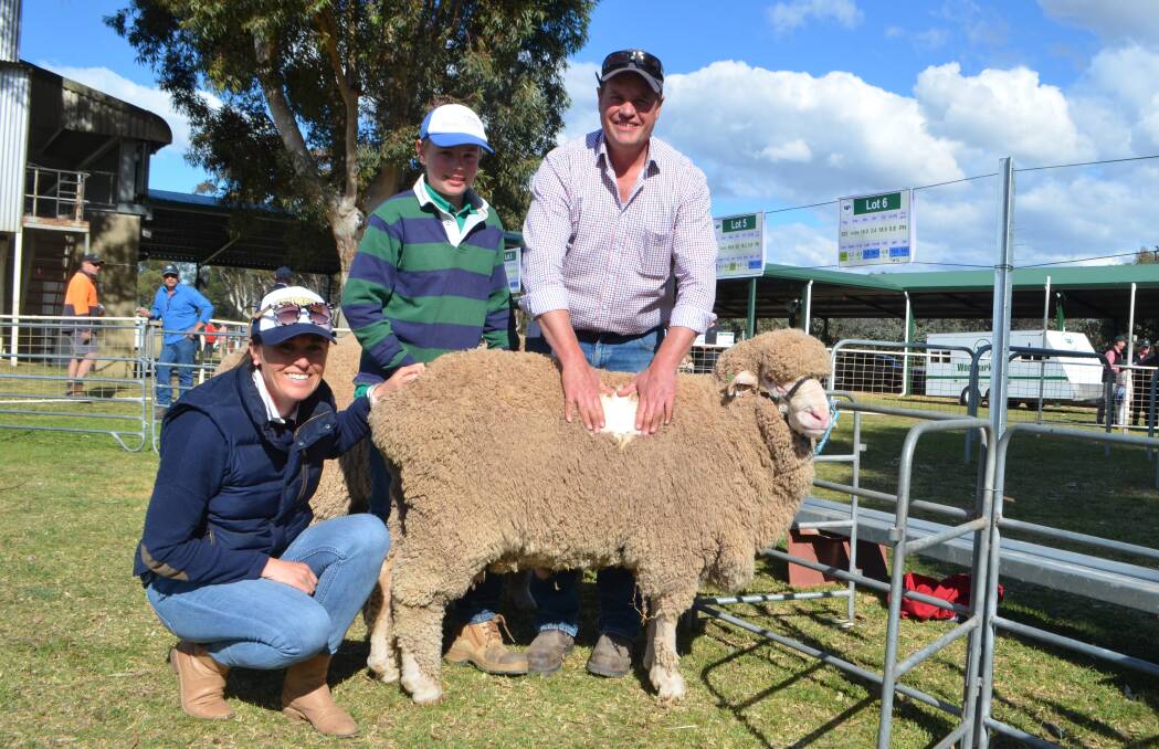 Sarah Houston (sister of Jack Glasson, Jimenbuen Pastoral Co, buyer of this ram) and Tom and Craig Wilson, Wagga Wagga with the $5,000 purchase.