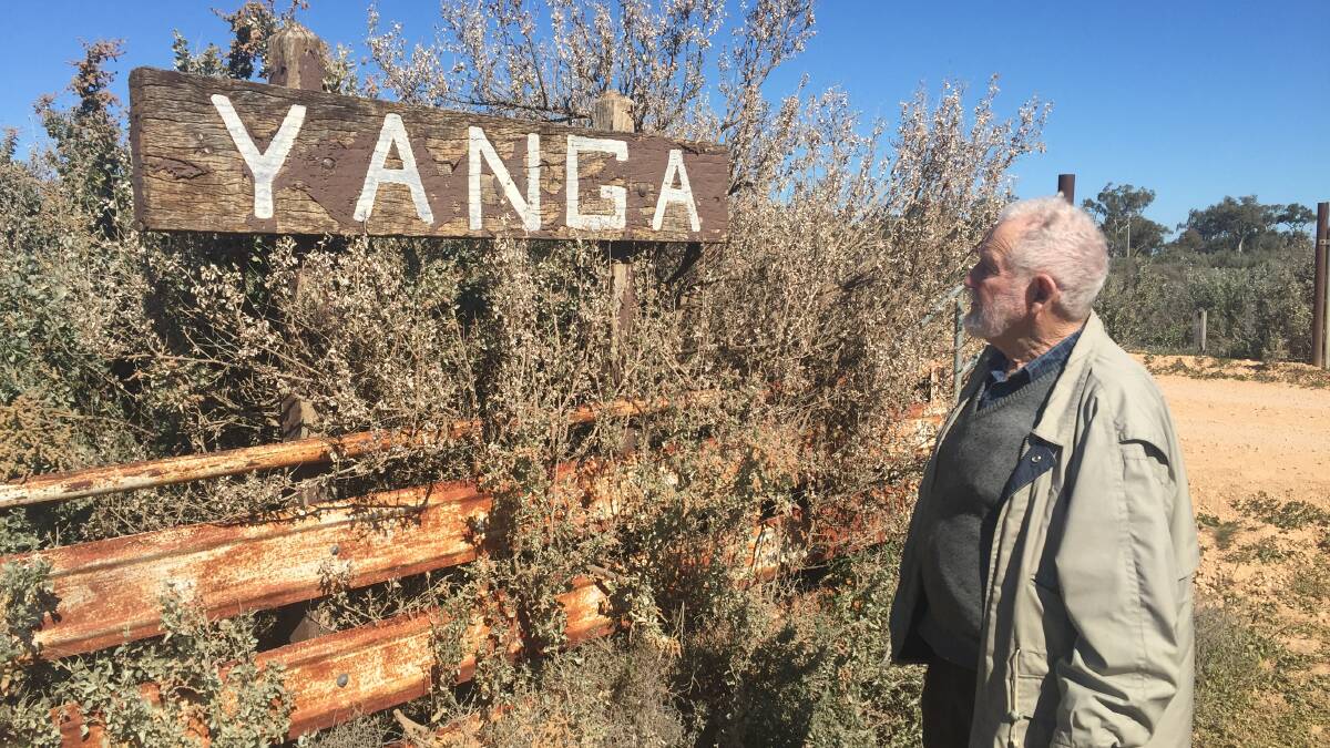 Alastair Cox admiring the sign to Yanga he erected over fifty years ago.