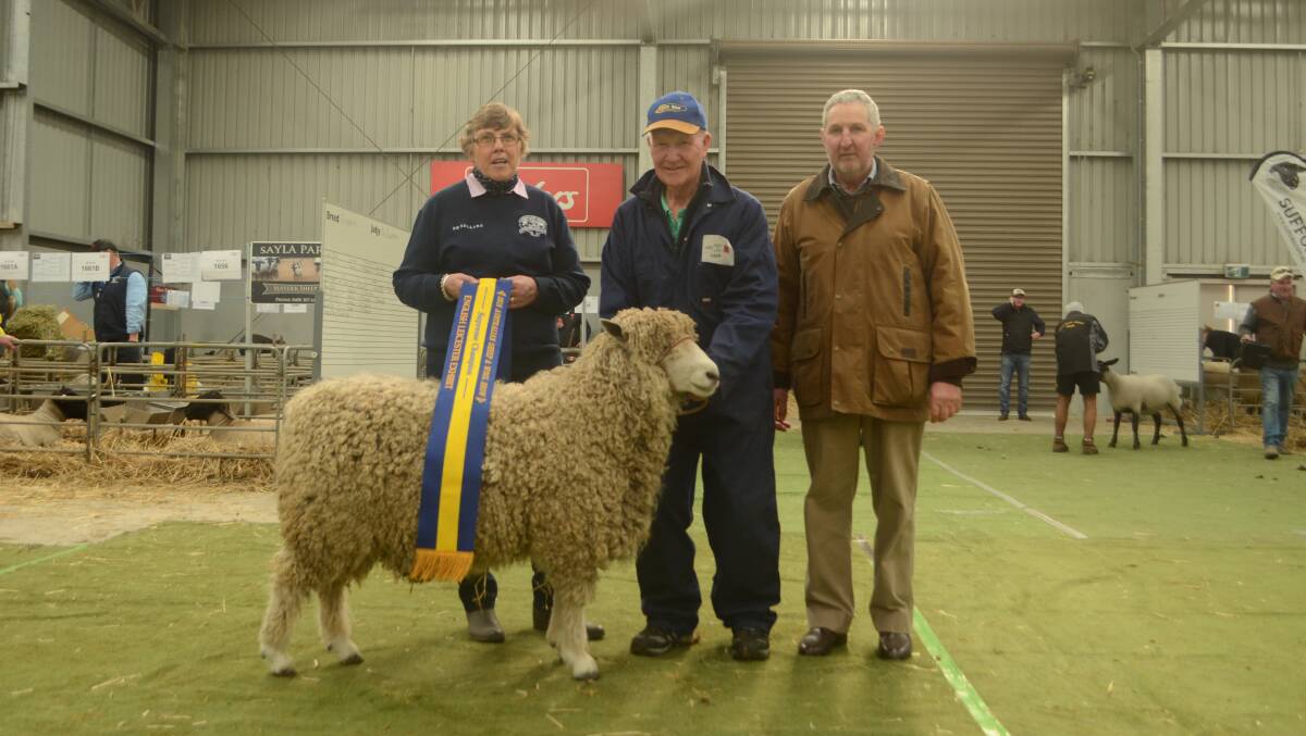 Judge Pam Tait, Ashburton, NZ, breeder Colin Taylor and Brenton Hazelwood, Whitemore, Tasmania, president of the Australian English Leicester Association with the supreme English Leicester exhibit.  