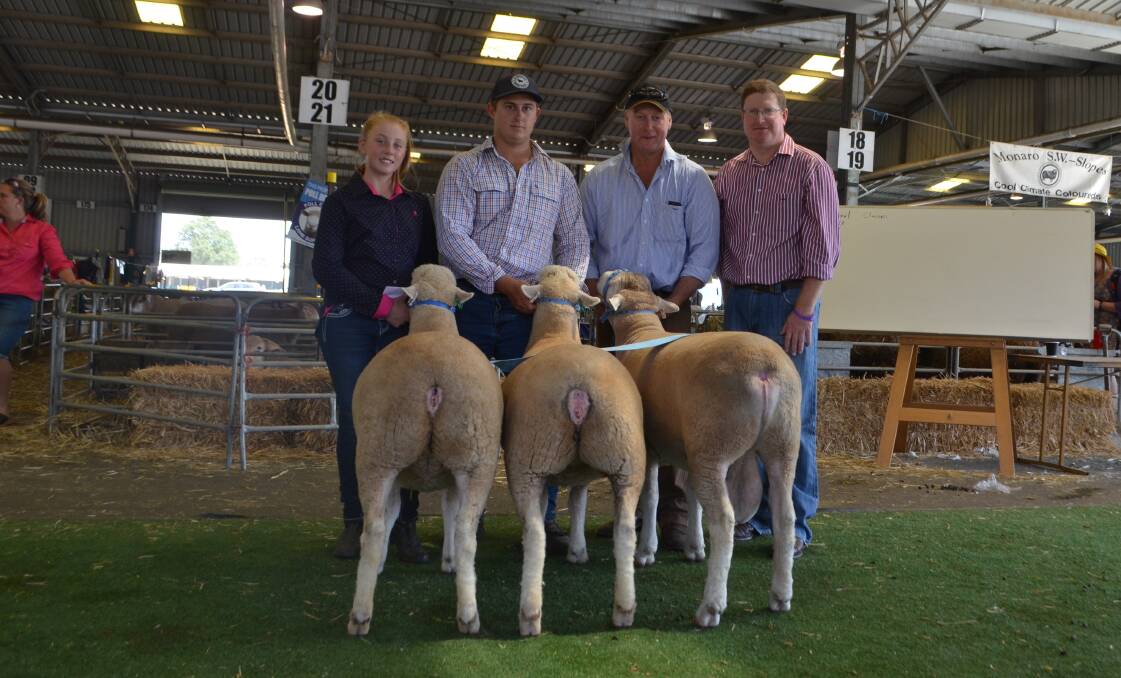 Chloe, Sam and Garry Armstrong, Armdale Poll Dorsets, Marrar, were presented with Fred Eldering Trophy for Prime Lamb Interbreed Group by Jason Barker, Parkes.