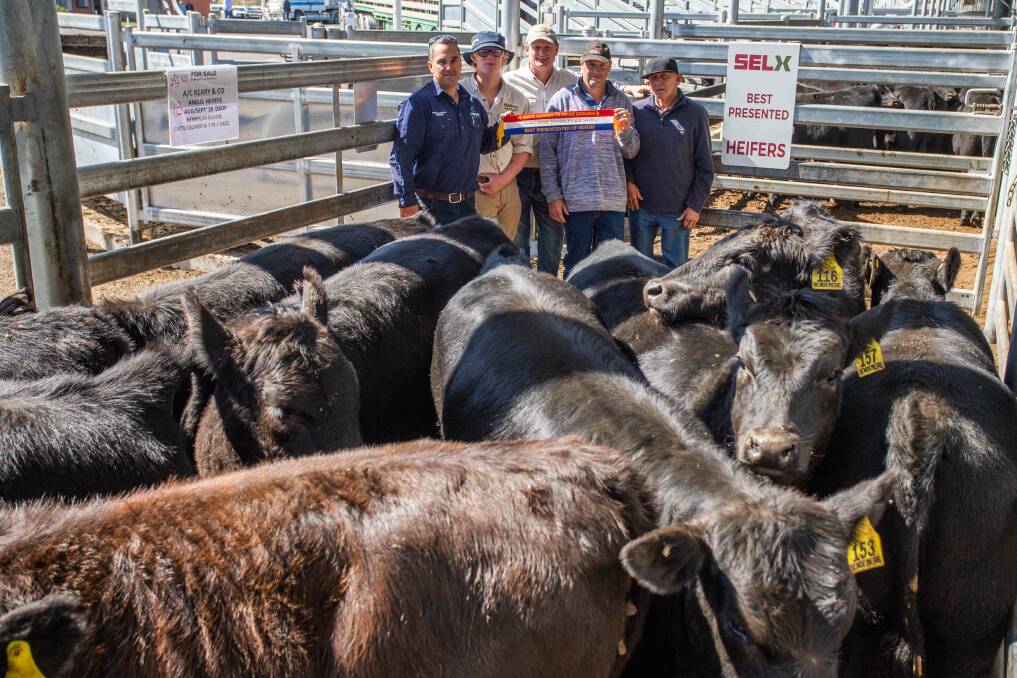 Best heifers: Sponsor Joel Conron, Conron Concrete Grenfell, agents Bailey and Greg Anderson, M.D and J.J Anderson, Crookwell with Peter Keary, Bannister who sold them for $655 and Barry Tosch. Photo: Heidie Grange