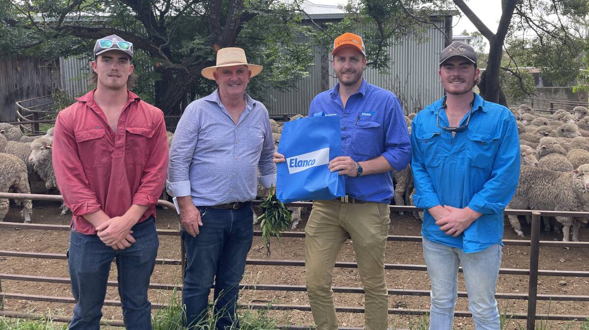 Rory, Dermot and Marty McGrath, Clear View Partnership, Boorowa, presented with a sponsor's bag by Dave Rathbone, Elanco (second from right).
