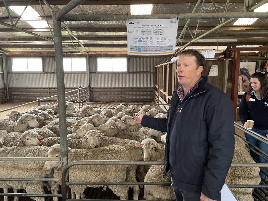 Ben Swain, chief executive officer of the Australian Merino Sire Evaluation Association, taking the attendees through each of the sire's progeny on display. 