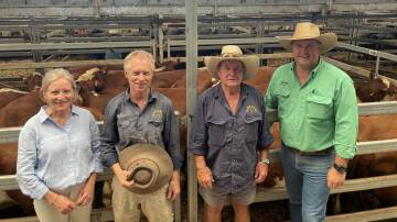 Wantagong principals, Cathy Simpson and Gordon Shaw, Holbrook, with Peter Stead, station manager, and Matt Pitzen, Paull and Scollard Nutrien Holbrook, with a pen of 19 Hereford heifers which sold for $1480. Picture by Stephen Burns.