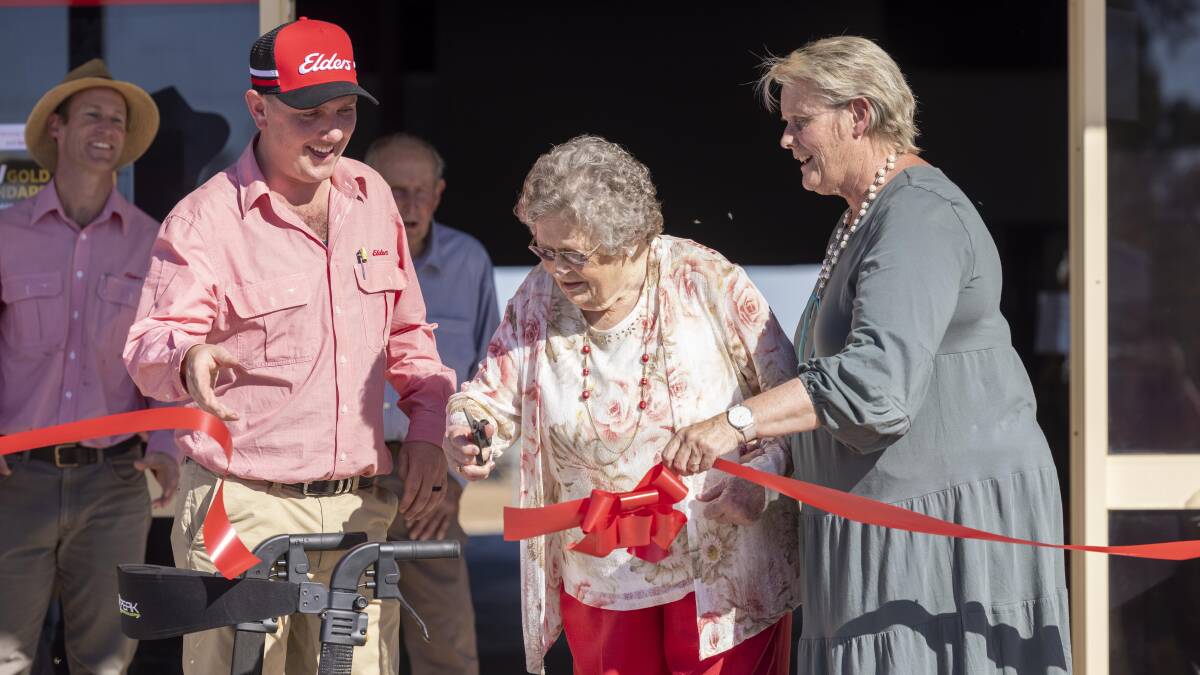 Elders Jerilderie, manager Nick Gray with Pat Curtin cutting the ribbon watched by mayor Ruth McRae. Photo: supplied