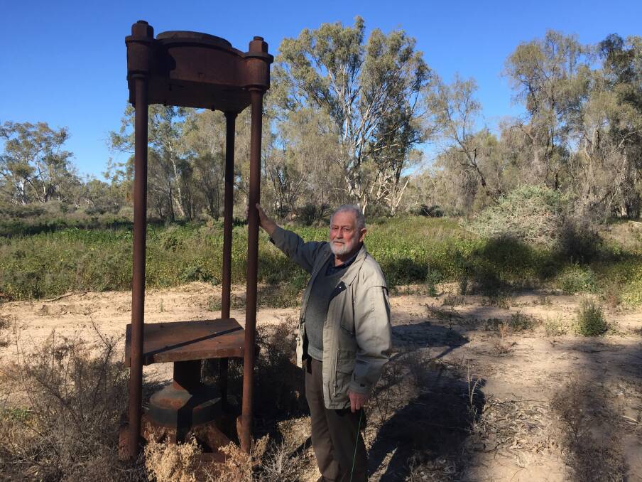 Alastair Cox with the old wool press at Woolshed Bend camping area on the Murrumbidgee River.
