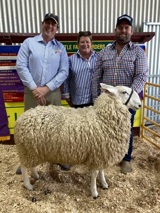 Jeff Sutton, Wattle Farm Border Leicester stud, Temora, with Emma and Zane Ryan, Dunedoo, and the top priced stud ram at $6000. Photo: Jeff Sutton
