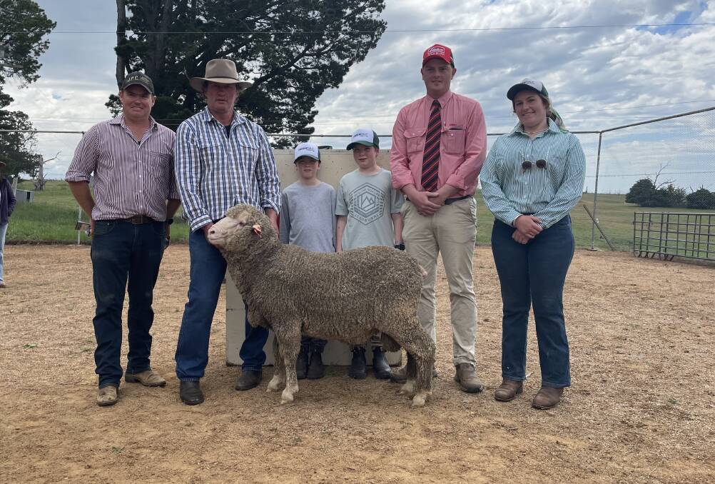 Top priced ram: Jack Glasson, Jimenbuen, Dalgety, with Mark McGuffick, Greenndale, Cooma, Max and Tom Glasson, with Tom McGregor, Elders auctioneer and Miranda McGuffick.