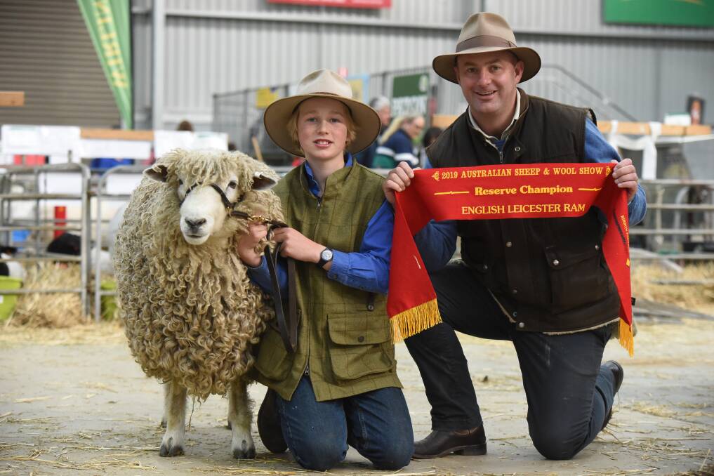 George Willows and his father Paul with his reserve champion English Leicester ram at the 2019 Australian Sheep & Wool Show. Photo: Ruby Canning