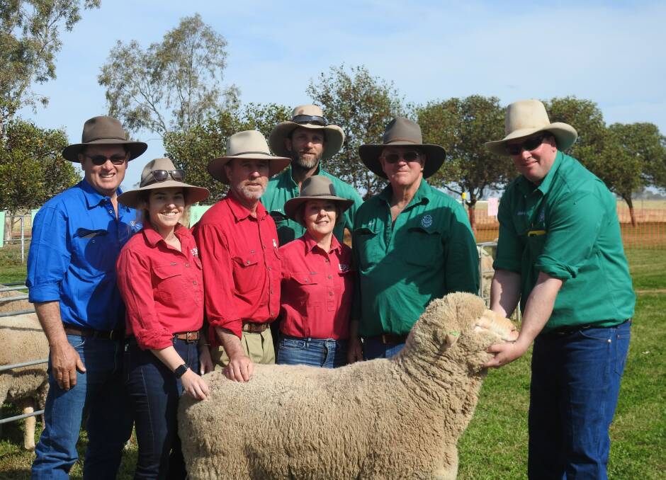 Colin McCrabb, Charleton Glenn, Robert and Alison Glenn, Mark, Geoff and Andrew Peters with the top priced ram. Photo: Dianne Peters
