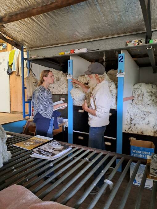 Lisa Bergstrand talking with John Ive about the environmental credentials of his superfine fleeces in the woolshed at Talaheni. Photo: Robyn Ive