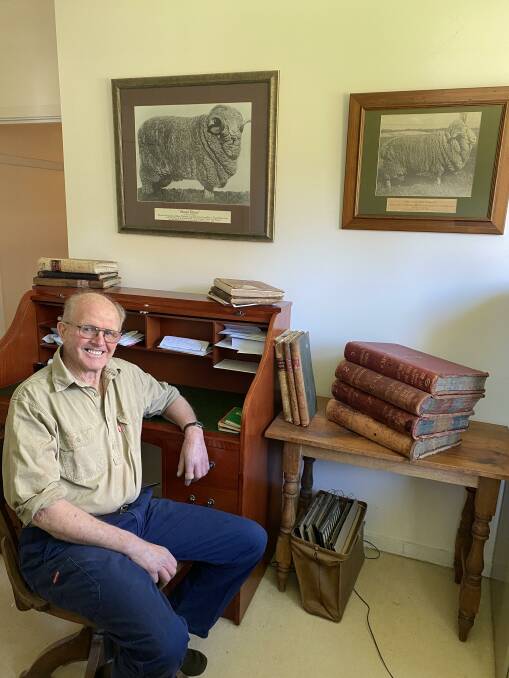 Tony Millear with photographs of Merino rams in his office. Photo: Sarah Millear