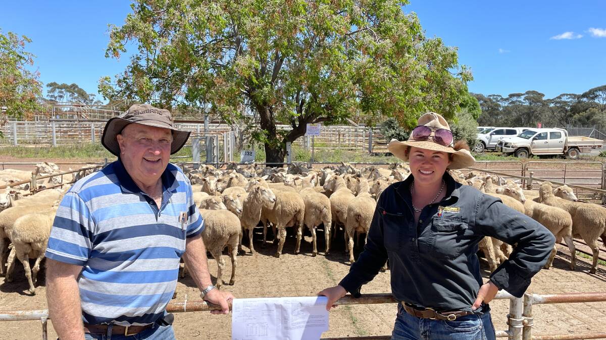 Peter Woods, Yalgogrin North, with Emma Northey, Quade Moncrieff Livestock and Property, West Wyalong, with the pen of first-cross ewes sold for $395. 