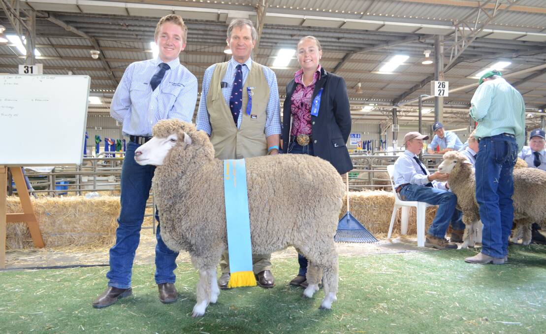 Tom Anderson, St Gregory's College, Campbelltown with the supreme Corriedale exhibit, a ewe bred in the school's Badgally stud with judge Gordon Forsyth, Glen Iris Bond stud, Bethungra and associate judge Katrina Abbott, Boolina, Wambool via Bathurst.