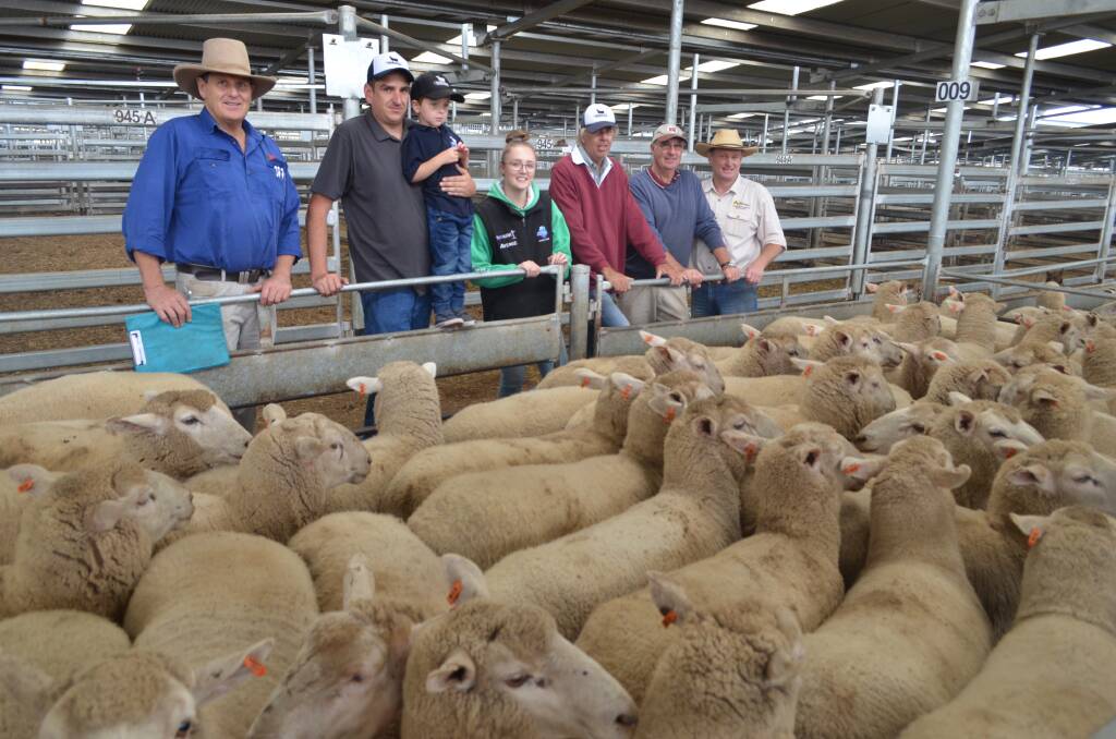 Top price pen: Rick Maslin, SELX Yass, Chris and Ryan Holding, Gemma and John O'Brien, Crookwell (vendor) Peter Southwell, Bookham (buyer) and agent Greg Anderson, Crookwell. 