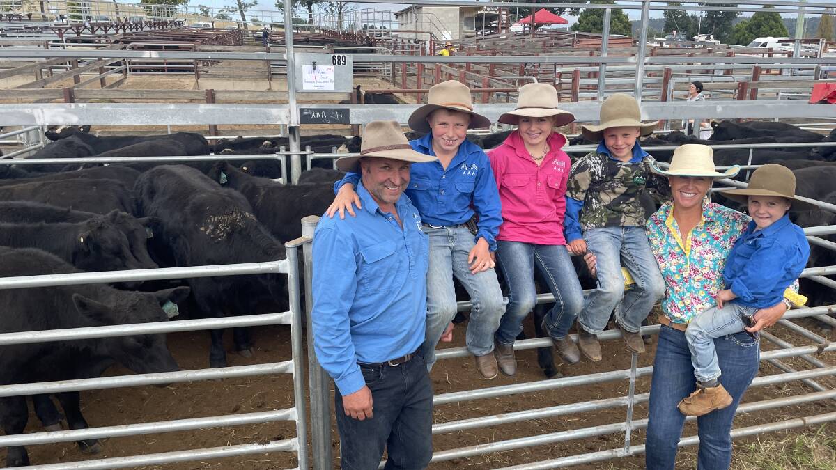 Alex, Archie, Ava, Alfie, Clare and Angus Andrich, Dalgety, with thier pen of 11 Rosskin/Hazeldean-blood Angus weighing 355kg sold for $2370.