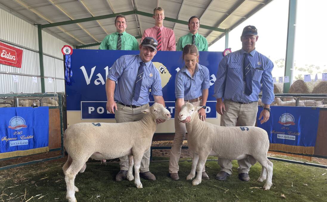 Top priced rams bought on AuctionsPlus held by Joe and Sally Scott with Andrew Scott, Valley Vista, Coolac - (back) auctioneers Tim Woodham, Harry Cozens and Hamish McGeoch. 