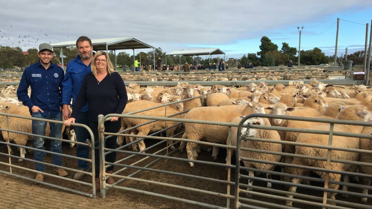 Top price: Shaun, Noel and Jodie Hoskinson "Bundoona" Kikoira with their $345 lambs. Photo: Mark Flagg