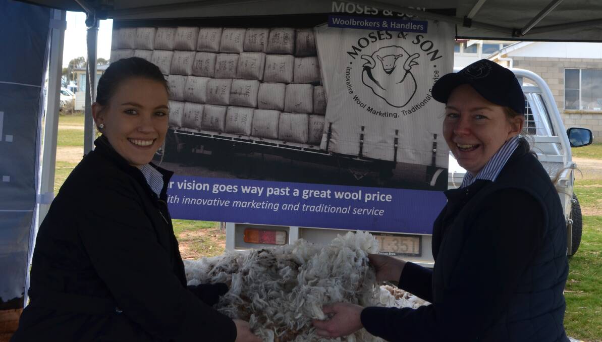 Assessing a fleece in the Moses and Sons display was Rachael Gawne and Adele Smith.