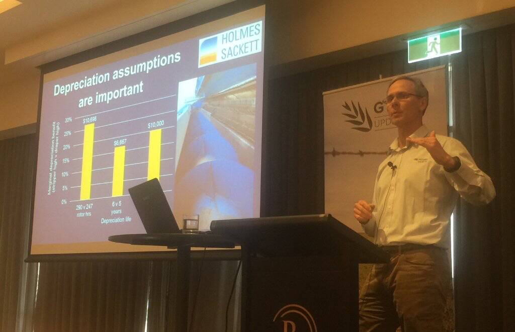 John Francis, Holmes Sackett, Wagga Wagga explaining the depreciation assumptions used in the economic modelling comparing draper and stripper fronts. Photo: supplied. 