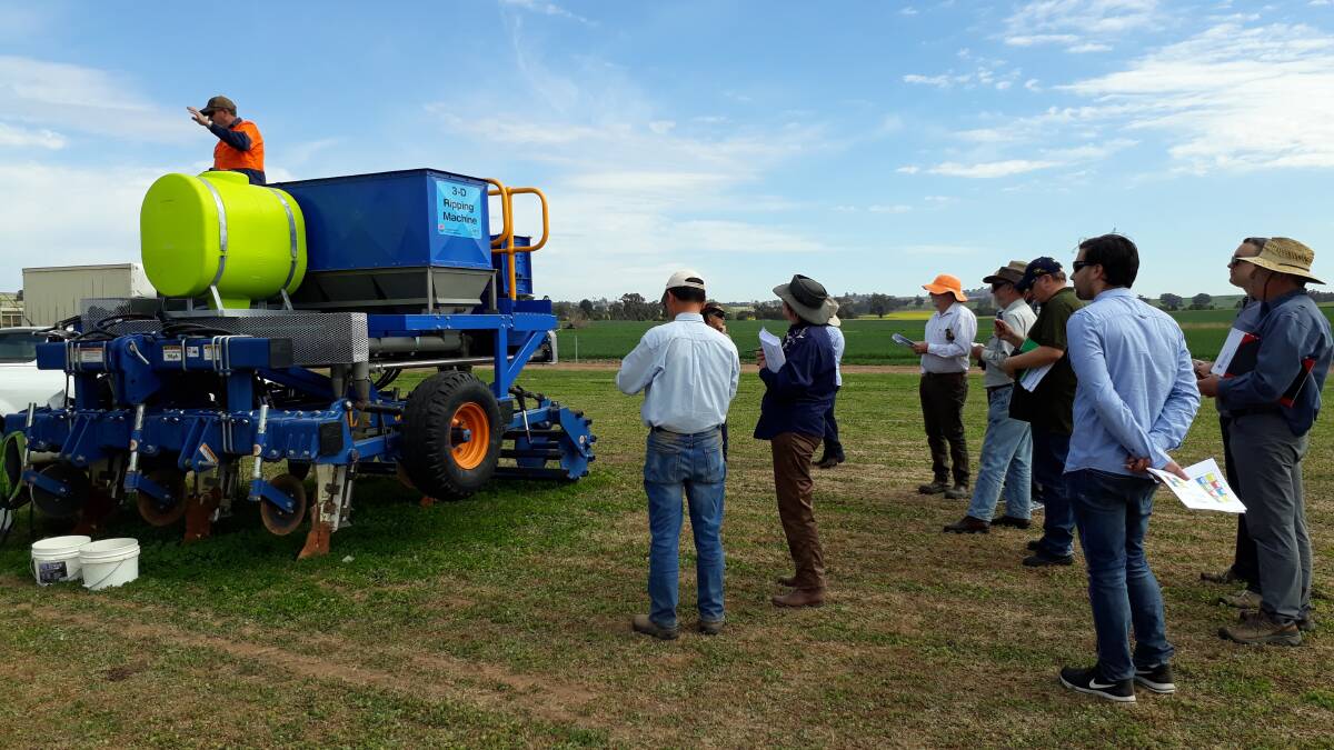 Interest in the effectiveness of the 3-D ripping machine at a recent on-farm trial west of Cootamundra. The machine has been built to specifications by engineering staff at DPI, Wagga Wagga. Photo: supplied 