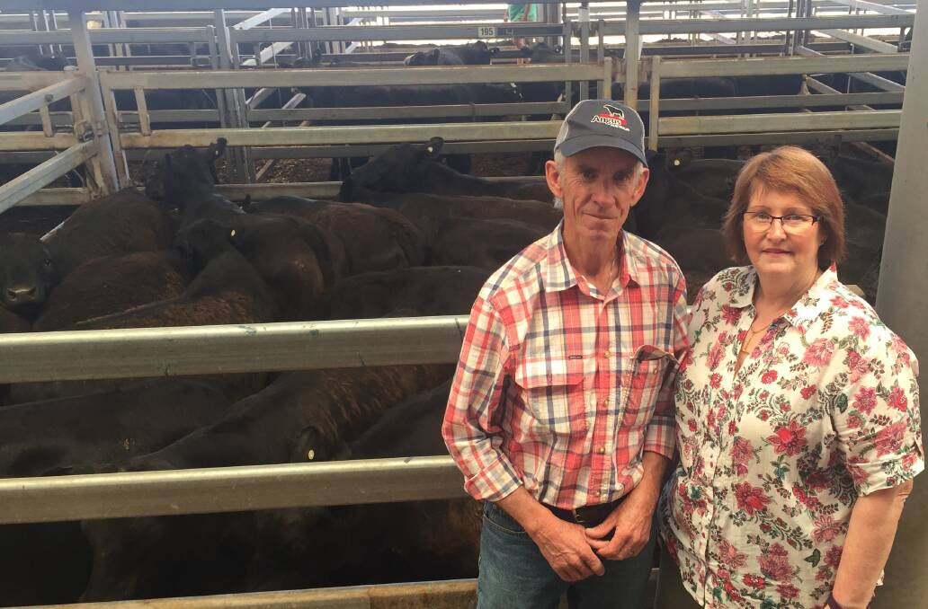 Peter and Helen Kirkbride, Baddaginnie, Victoria, with their pen of 26 Angus steers weighing 369kg which sold to a repeat buyer for $1150.