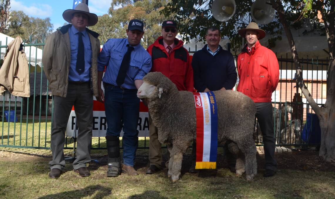 Justin Campbell, Shannon Mitchell, Clyde McKenzie, judge Alan Dawson, Winyar stud, Canowindra and Lachlan Boyd with Elders Riverina Ram of the year sponsored by Elders. Bred by Australian Food and Agriculture, Poll Boonoke, Conargo.
