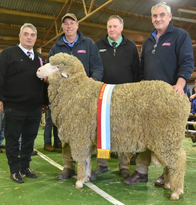 Supreme exhibit - Ian Lugsdin, presenting the Lugsdin Toyota Fabstock Bill Lamb Perpetual Trophy to Doug Walker, Wongara, with Stephen Chalmers, Nutrien stud stock and Steve Gates, Fabstock Wagga Wagga.