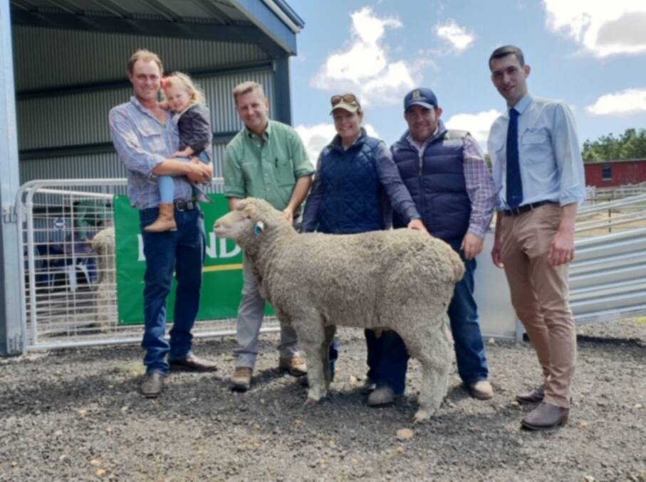 Aaron and Millie Granger, with Rick Power holding the $4000 ram purchased by Sarah Shiel and her husband Aaron Wild, and Ben Stace, AWN, Goulburn. Photo: Supplied