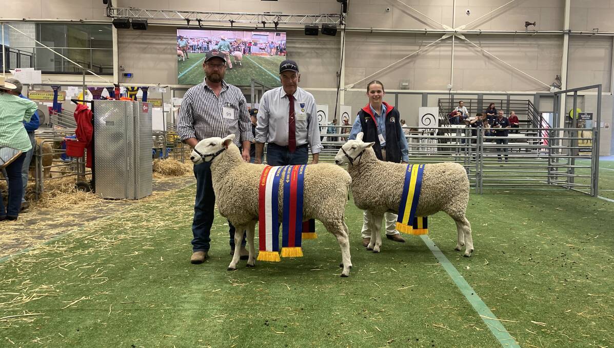 Jamie Buerckner, Bauer, Ariah Park, with his grand champion Border Leicester ewe, judge Ian Baker, and Grace Hoffman, parading the reserve grand champion ewe from Wattle Farm Border Leicester stud, Temora.