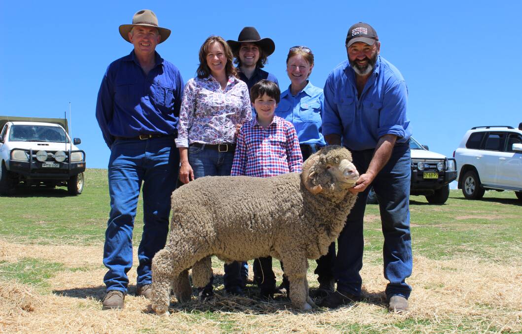 With the top priced ram at $2,000 - David Bingley, Weerona Apiaries, Sutton, Jayne, Cade and Jamie Lette, Jenny Bingley and Pete Lette, Conrayn Merinos, Berridale parading the ram. Photo: Monaro Post
