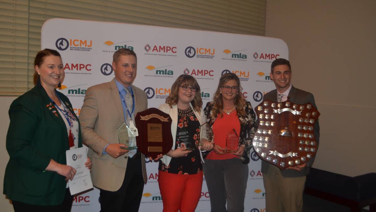 Demi Lollback, MLA, presenting the Roy McDonald Shield sponsored by Meat and Livestock Australia (MLA) to the team from Colorado State University, USA 