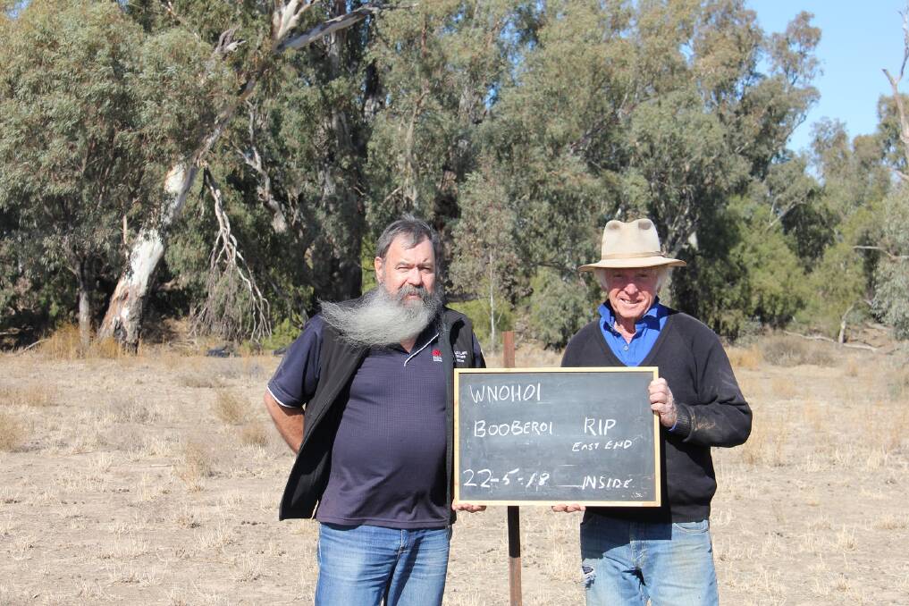 Weed control: Brian Dohnt and Dennis Stewart at a photo point on Booberoi Station. Photo: supplied 
