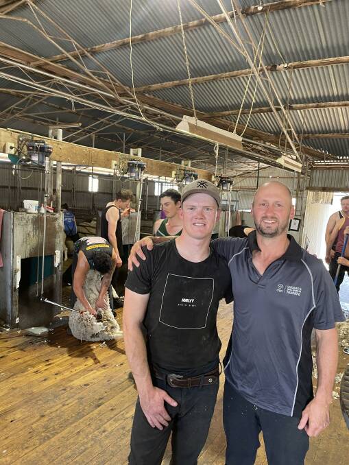 Ricky McMahon with AWI shearer trainer Josh Clayton in the shearing shed at Newington, Harden.