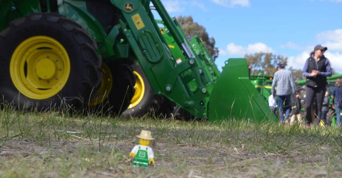Lego® Farmer from Little Brick Pastoral looking over a selection of big tractors during his visit the Henty Farm Machinery Field Days
