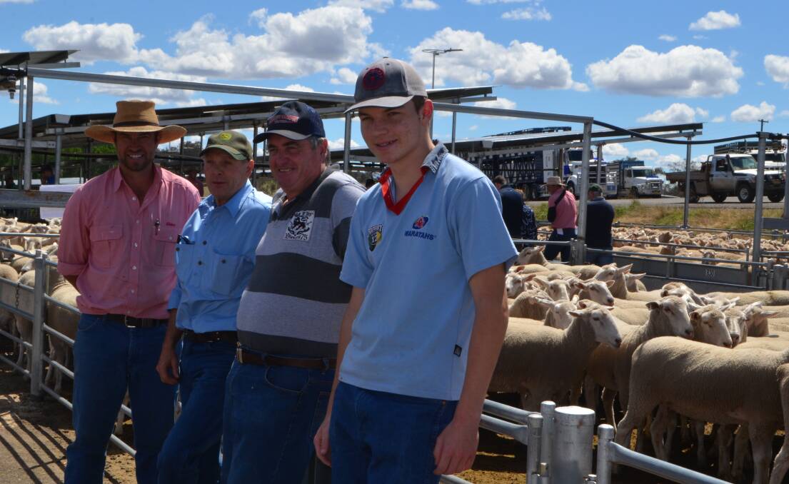 First-cross ewe sale topper: Elders, Yass agent Michael Coggan with client Brent Medway, Gunning who sold 124 ewes for sale top at $334, Murray Slater, Laggan and Sydney visitor Oliver Blake, Illawong.

