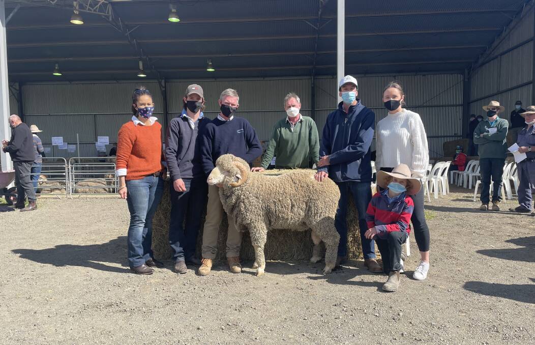 Leeanne, Patrick, Pat and Andrew Davis, with Geoff Burley, Guyra, Abby Davis and Dan Minehan with the top priced ram.