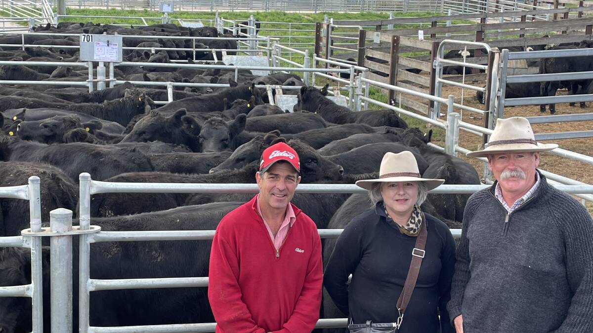 Sam Green, manager Elders Cooma, with Deb and Allan Weston, Moonbah, and their pen of 55 Raff/Hazeldean-blood Angus steers eight months and weighing 344kg sold for $2355.