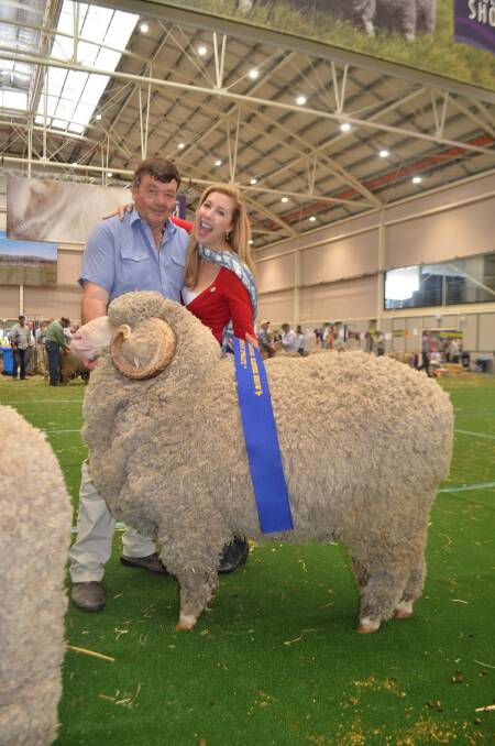 Wal Merriman, Merryville Merinos, Boorowa being congratulated by Merino Ambasadress Catriona Rowntree on exhibiting the champion March-shorn finewool ram