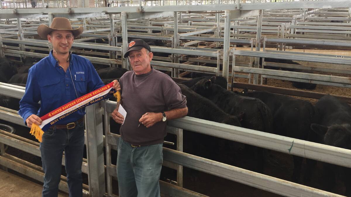Best presented pen of steers - Sam Hunter, AgStock, Yass with Geoff Jones, manager for Burn and Daniel, Yass and the pen of 26 Bongongo-blood Angus steers weighing 329kg sold for $1865.