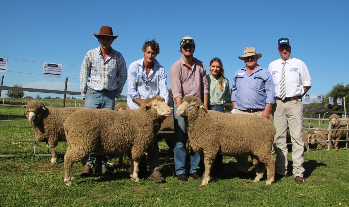 Will, John and James Nadin, Felicity Schiller of Macquaie Dohnes with Chris Clemson, Clemson, Hiscox & Co and auctioneer Paul Dooley and the two top priced rams.