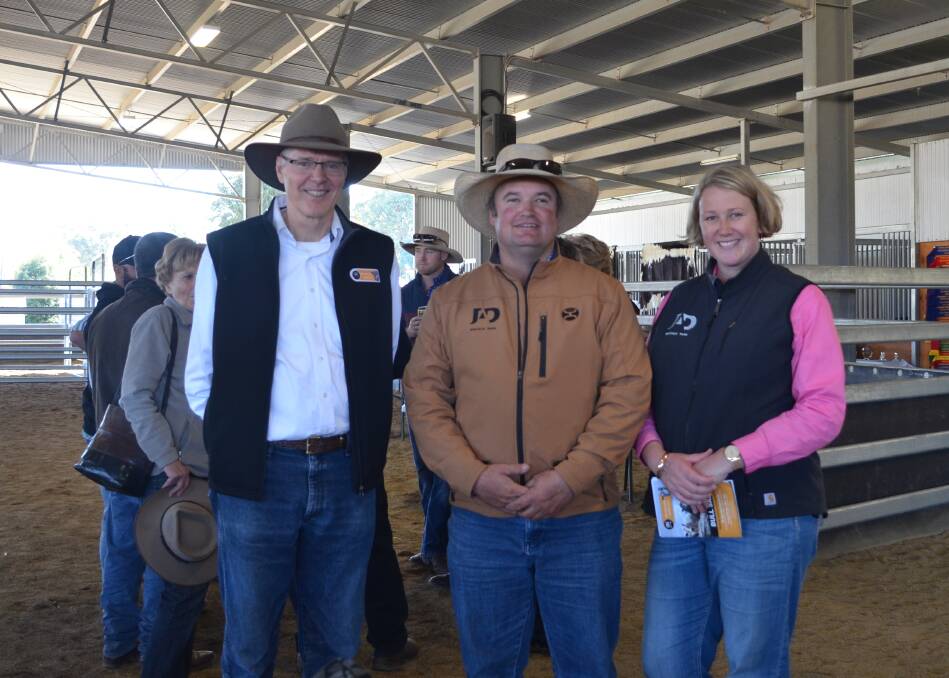 David Reid, Minnamurra Speckle Parks, with Justin and Amy Dickens from JAD Speckle Park after the sale where the Dickens purchased their bull for $30,000.