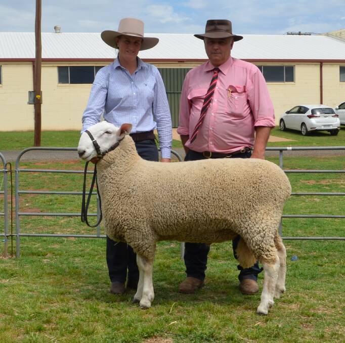 Rowena Sweeney and Scott Thrift with the top priced ram who sold for $4000 to an undisclosed buyer after the sale.
