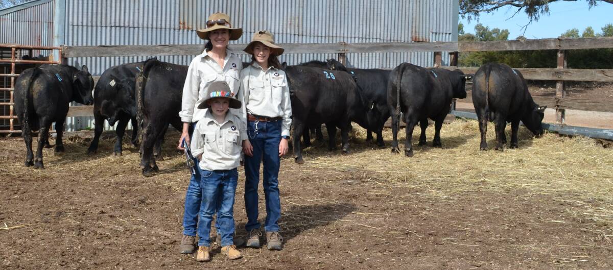 Noonee Angus principal Netta Holmes Lee with her children Demelza and Harry Lee after the sale.