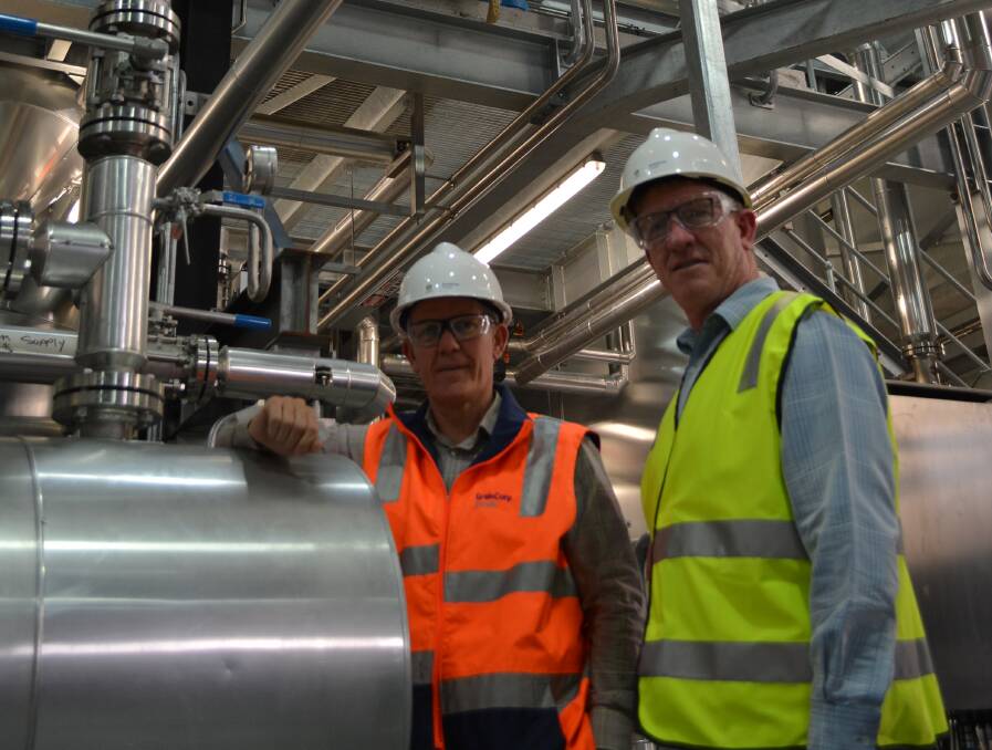 Newly commissioned vegetable oil refining equipment at GrainCorp Oil's West Footscray plant in Melbourne being checked by oils division group general manager, Sam Tainsh and site operations manager, Graeme Lowry. 